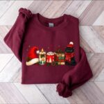 Cat Book Christmas Sweatshirt, Funny Characters Christmas Sweater, Xmas Hot Cocoa Holiday Crewneck